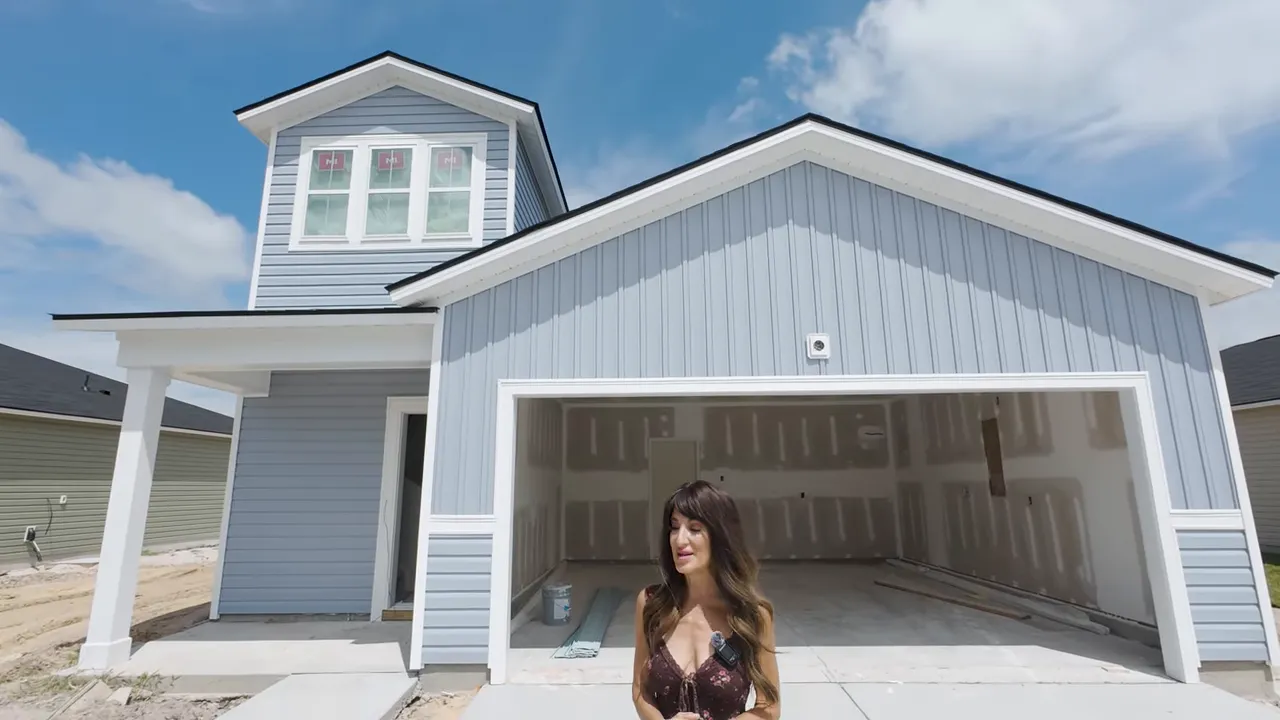 Covered porch and outdoor living area with new construction home exterior in Little River SC