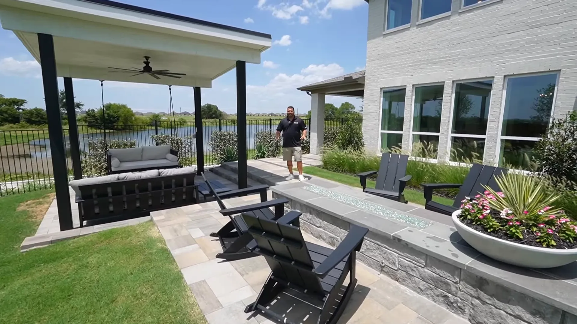 Side patio with covered dining area and ceiling fan