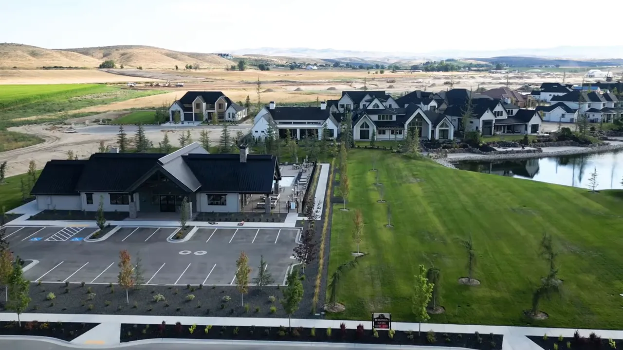 Aerial view of a residential neighborhood with a small commercial strip and tree-lined streets near Terra View