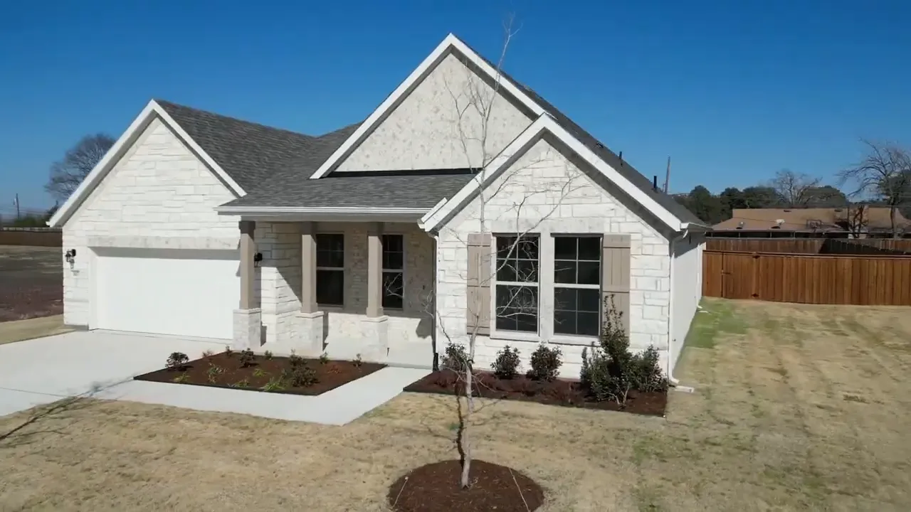 Front exterior of a one-story new home near Dallas Texas with 4 bedrooms, 3 baths, and a 2-car garage