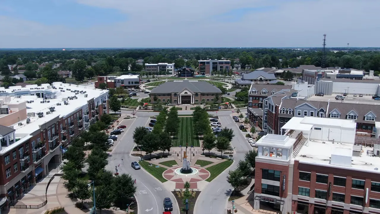 aerial view of downtown fishers labeled nickel plate district with central green space