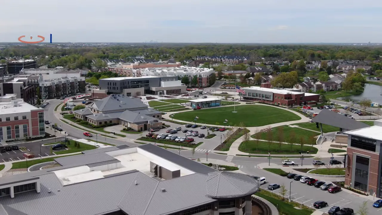 aerial view of downtown fishers with green space apartments and streets