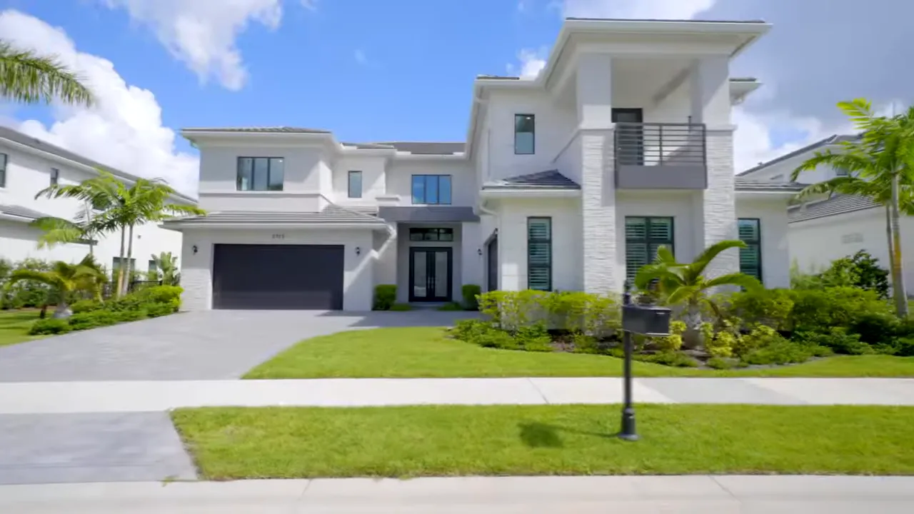 Luxury backyard with pool and outdoor kitchen at Royal Palm Polo