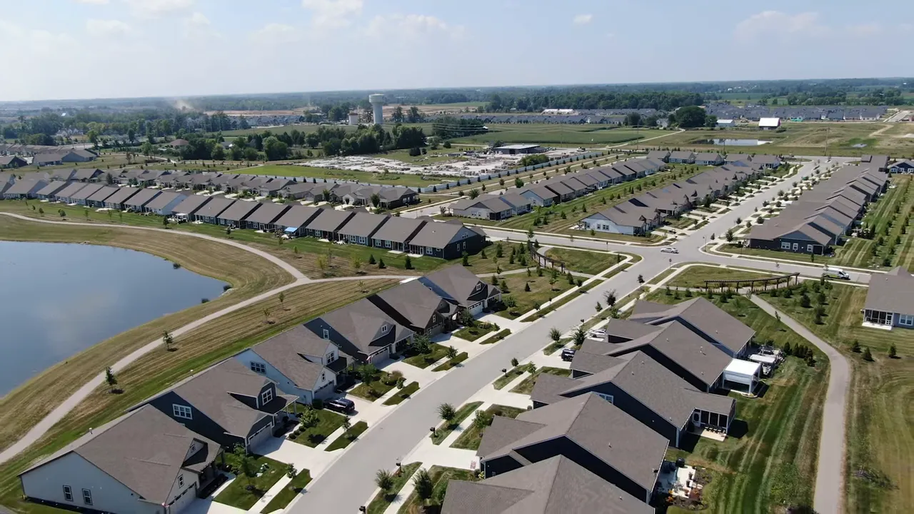 New construction street in Westfield with model homes and for-sale signs