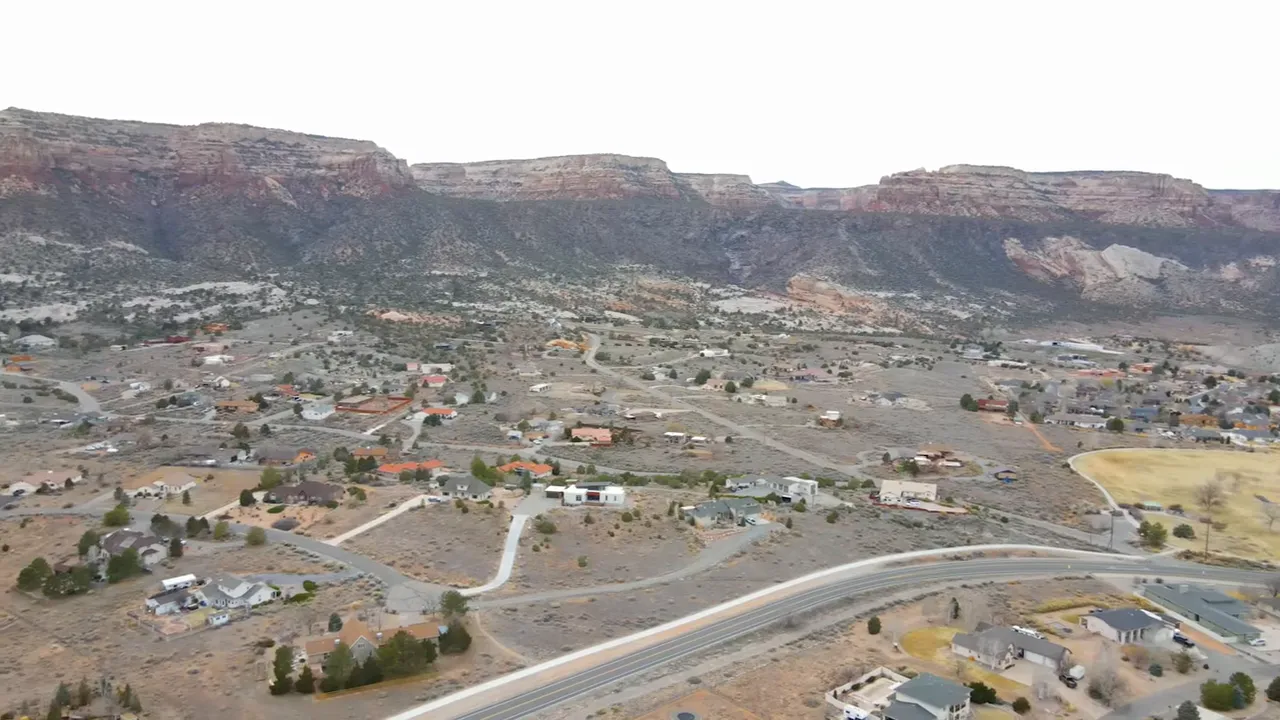 Drone aerial of a dense suburban block with small yards and homes close together in Grand Junction
