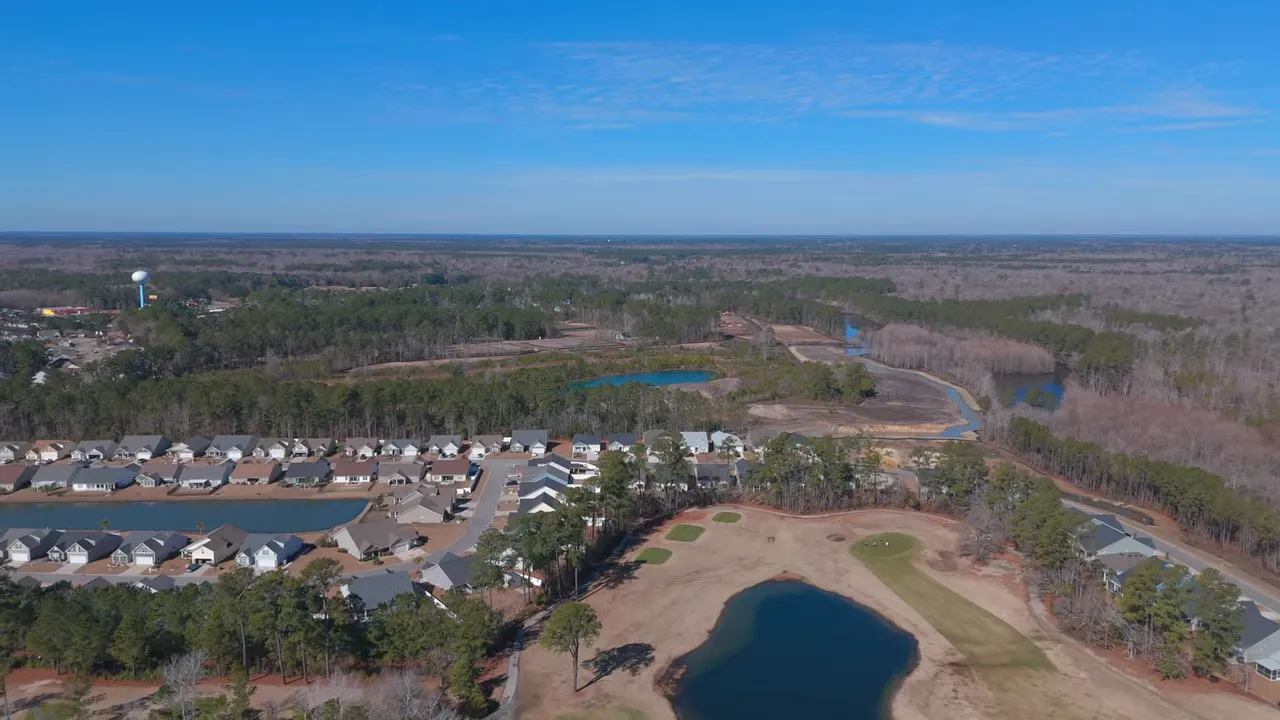 Clear RealScout interface screenshot showing map with price markers and a detailed listing table for The Overlook subdivision in Longs, SC.