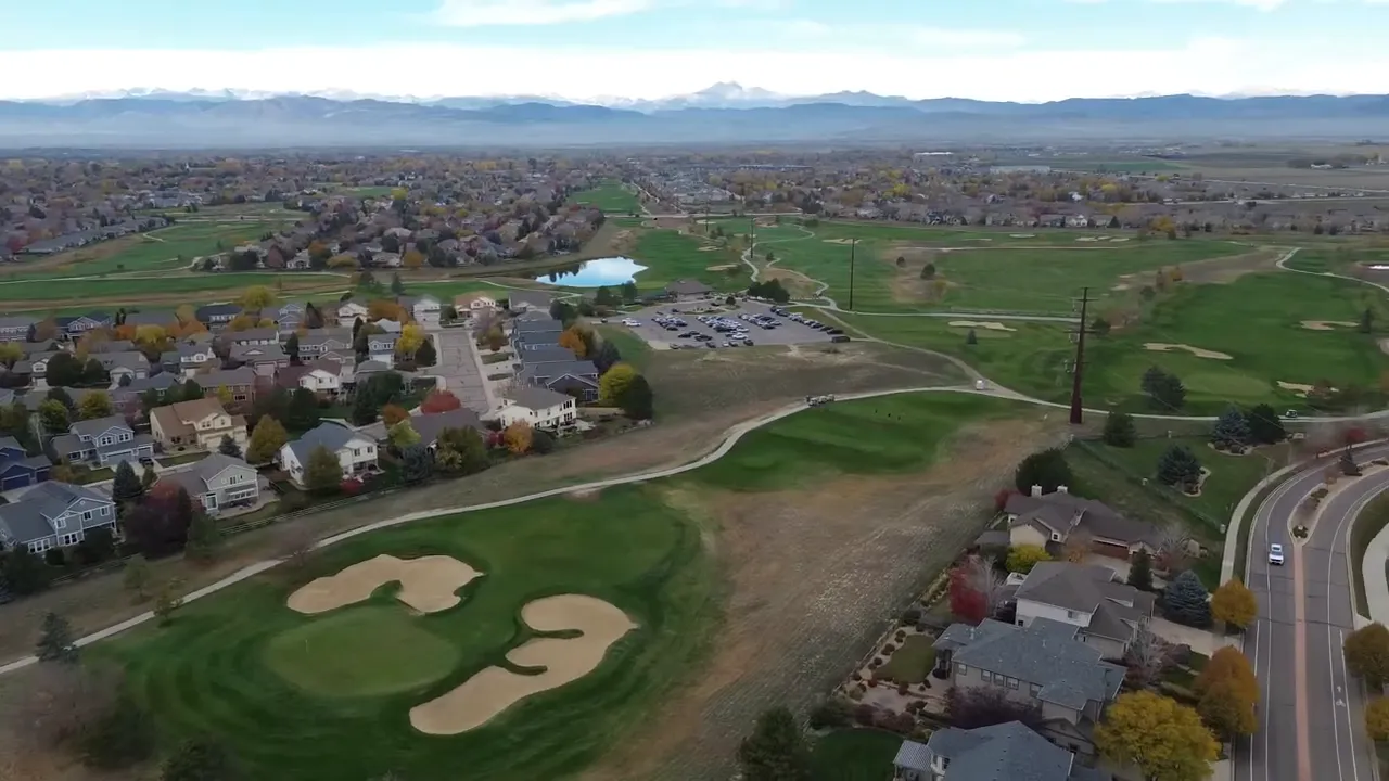 Aerial view of North Longmont Colorado neighborhood with golf course and surrounding open space