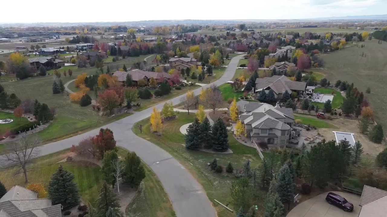 Aerial view of a neighborhood with text reading 'METRO TAXING DISTRICT'
