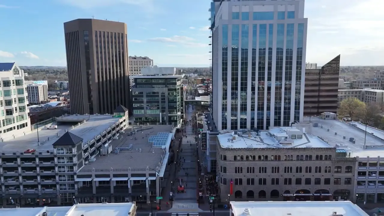 Aerial view of downtown Boise showing mid-rise office buildings and a pedestrian street between them