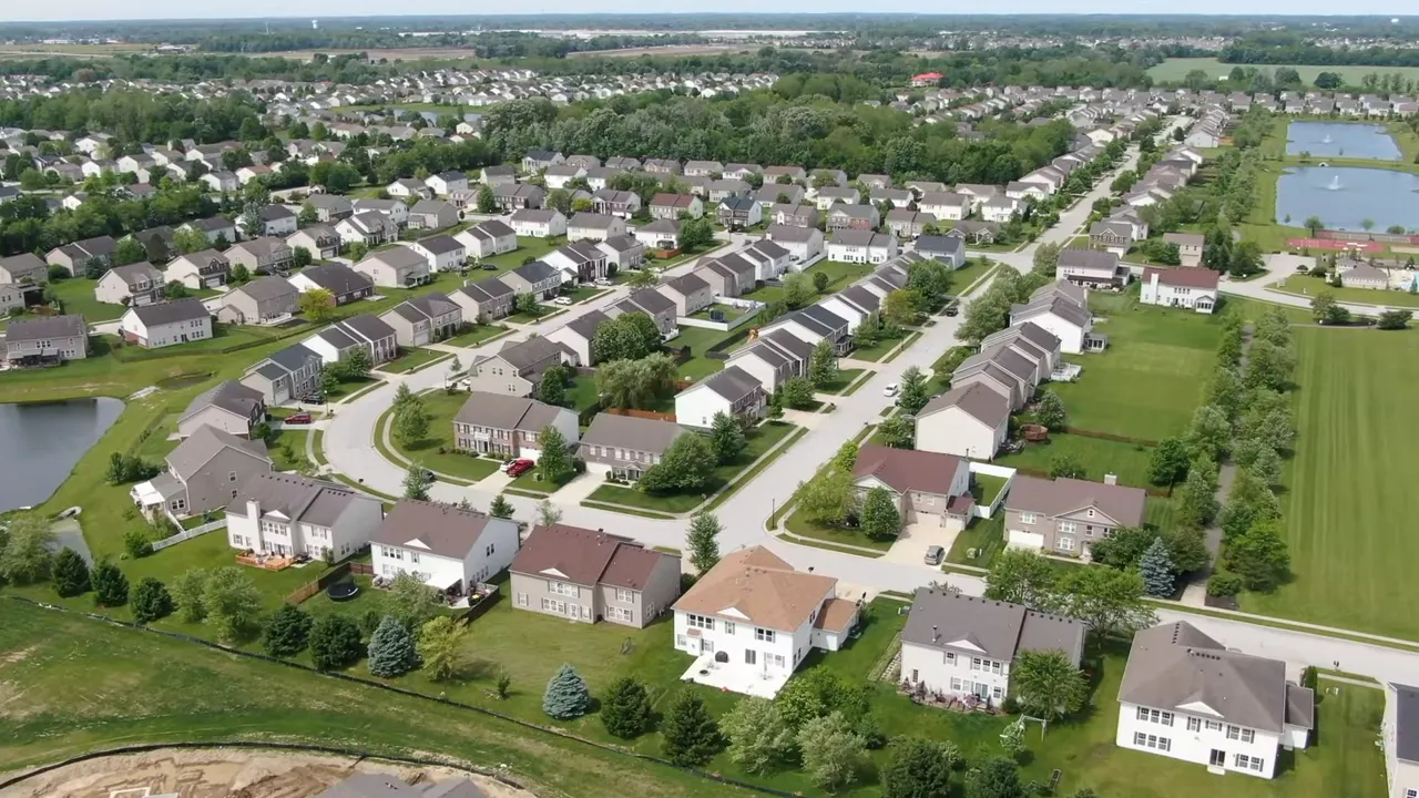 Chart showing Indianapolis median sale price $248,000 with a three-year trend line and homes-sold stats.