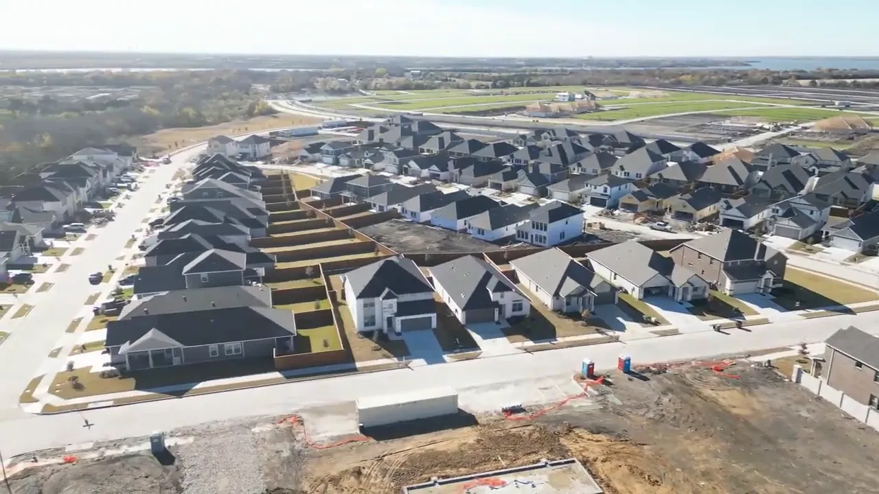 Aerial view of Lakehaven streets homes and active construction