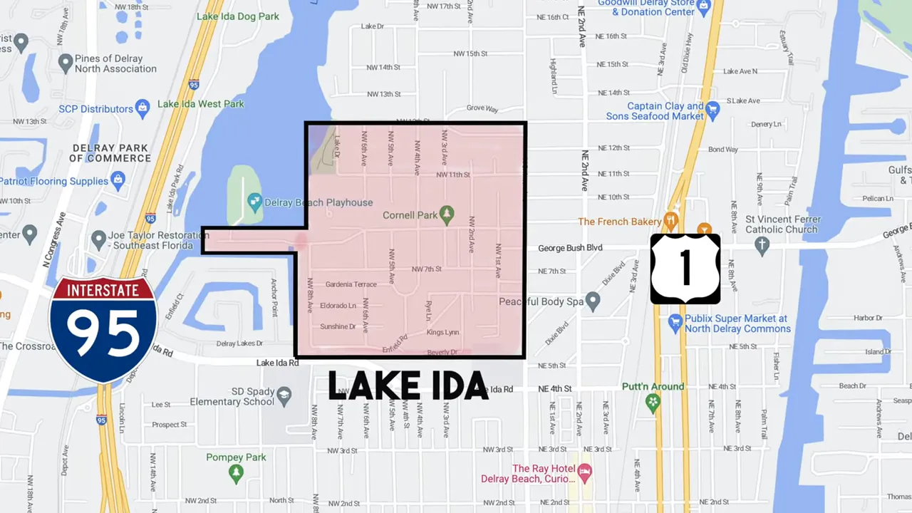 Wide view of Lake Ida open water and residential shoreline with presenter in foreground