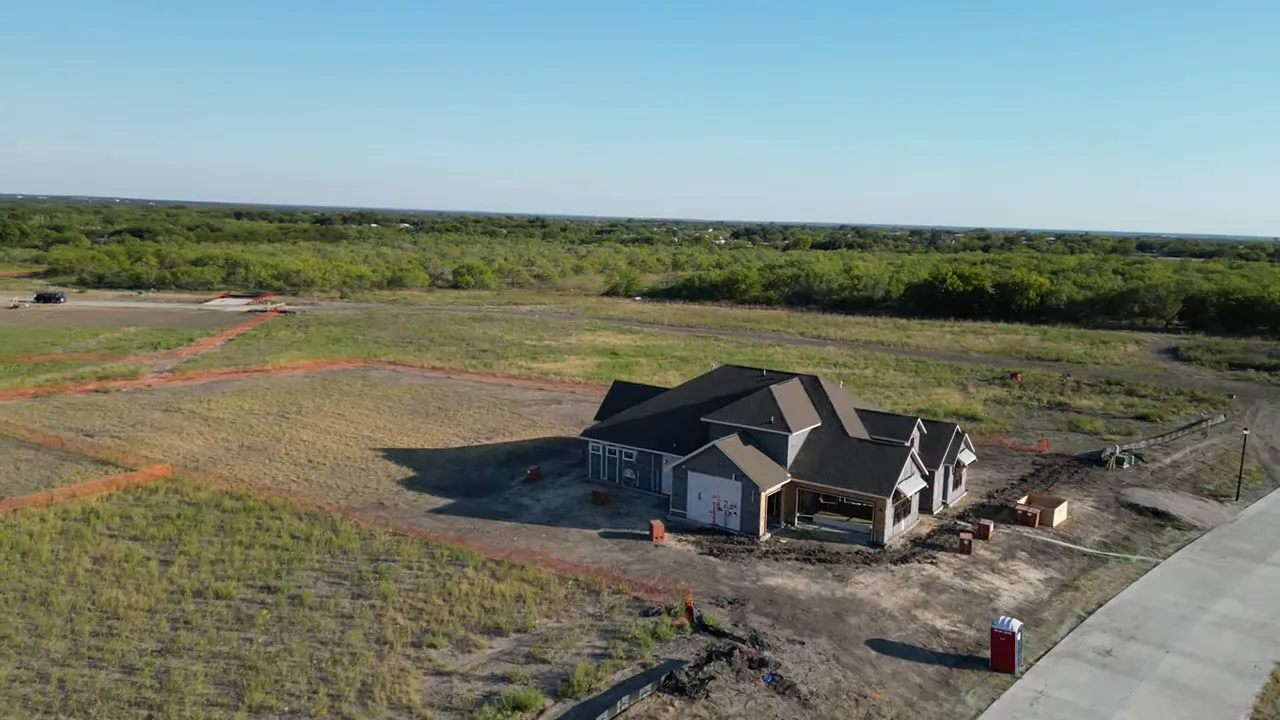 Aerial view of Ridgepark lots and roads with homes start at mid 600k text