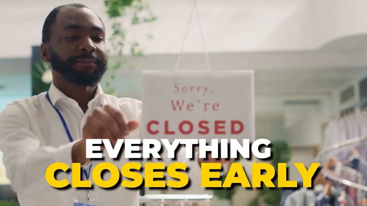 Sign in a Columbus business window reading 'Closed' with 'Everything closes early'