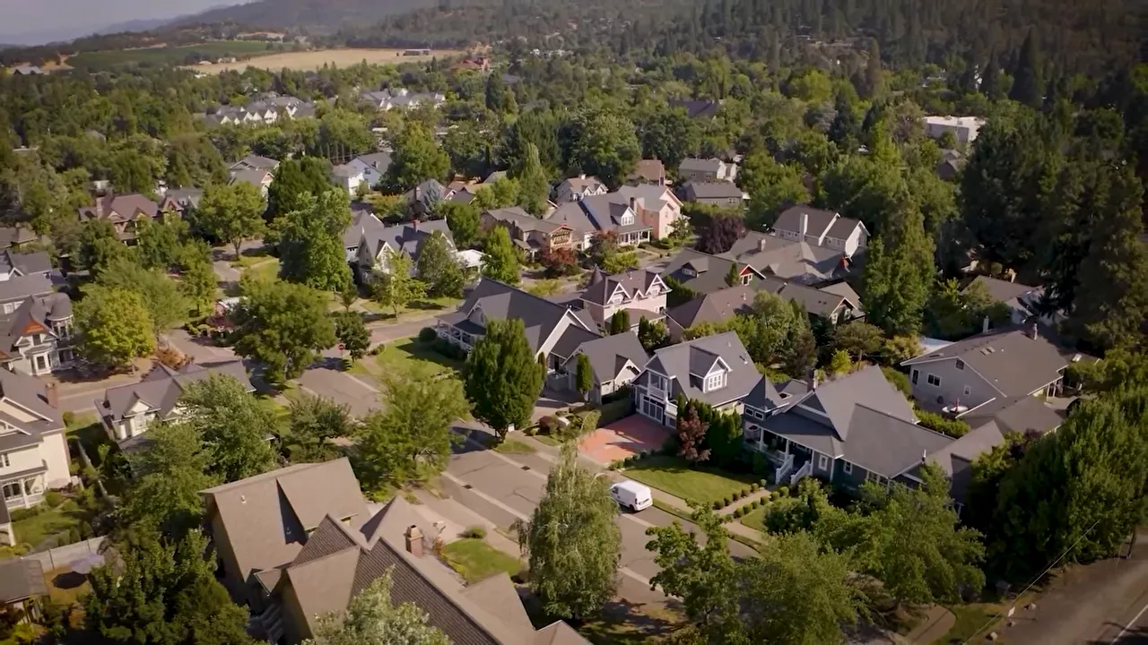 On-screen graphic showing the Southern Oregon real estate struggling category including homes with deferred maintenance, unpermitted structures, trashed neighboring properties, and the nosy or rude neighbor