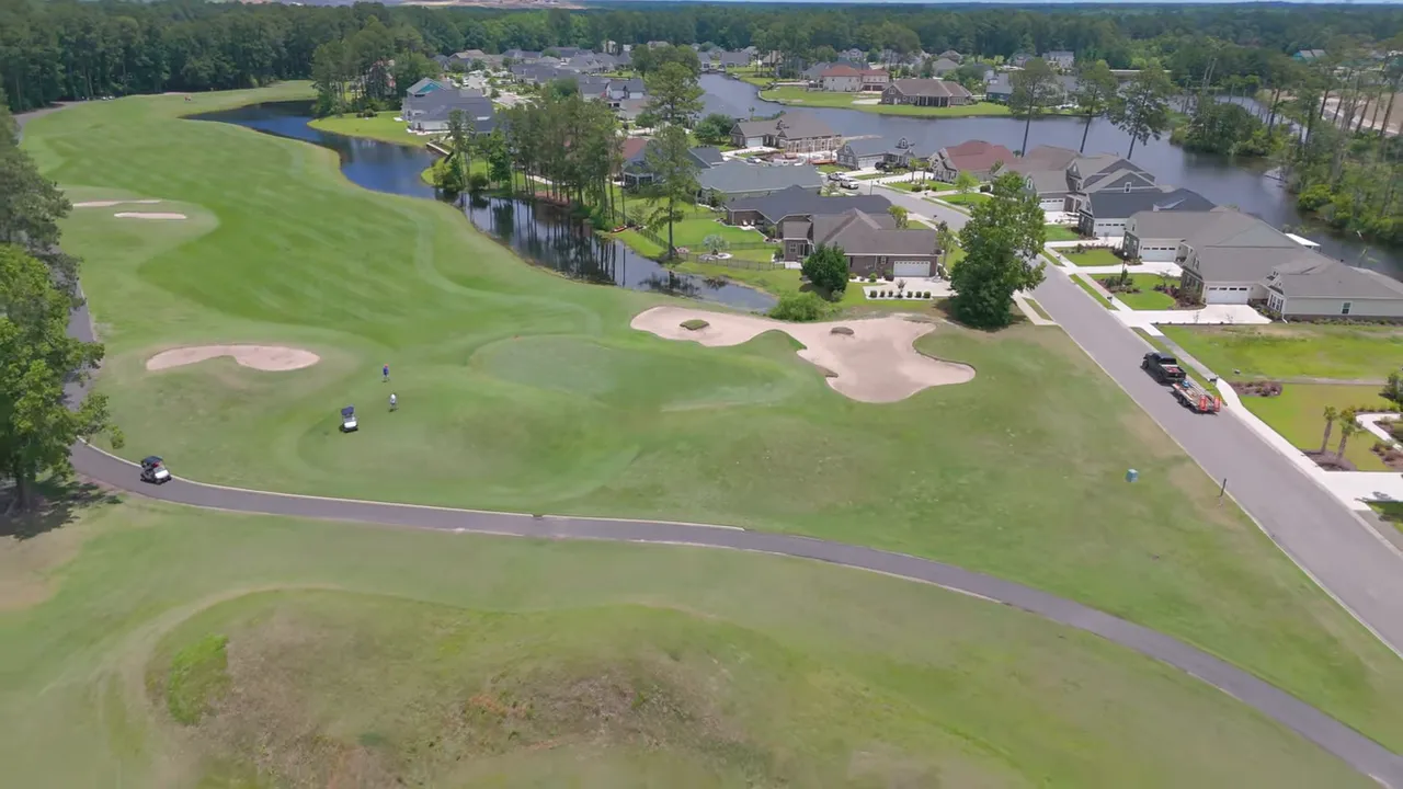 Google Maps wide aerial view of a Conway new-construction area with a presenter inset