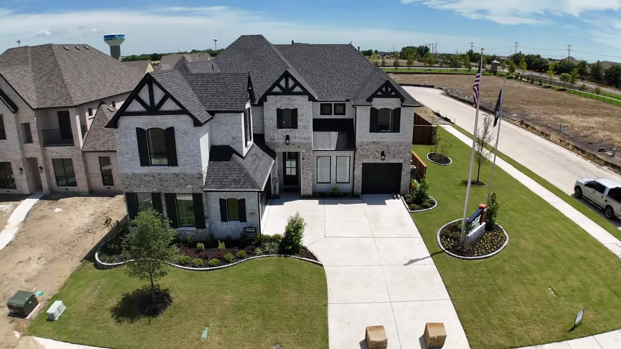 Aerial view of homes under construction with Nelson Lakes text on screen