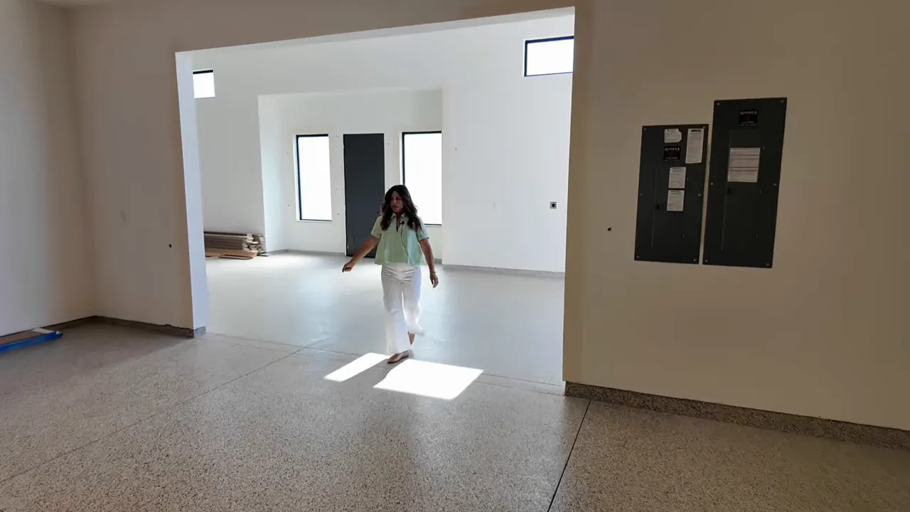 Large white RV garage interior with tall ceilings and wide open floor space