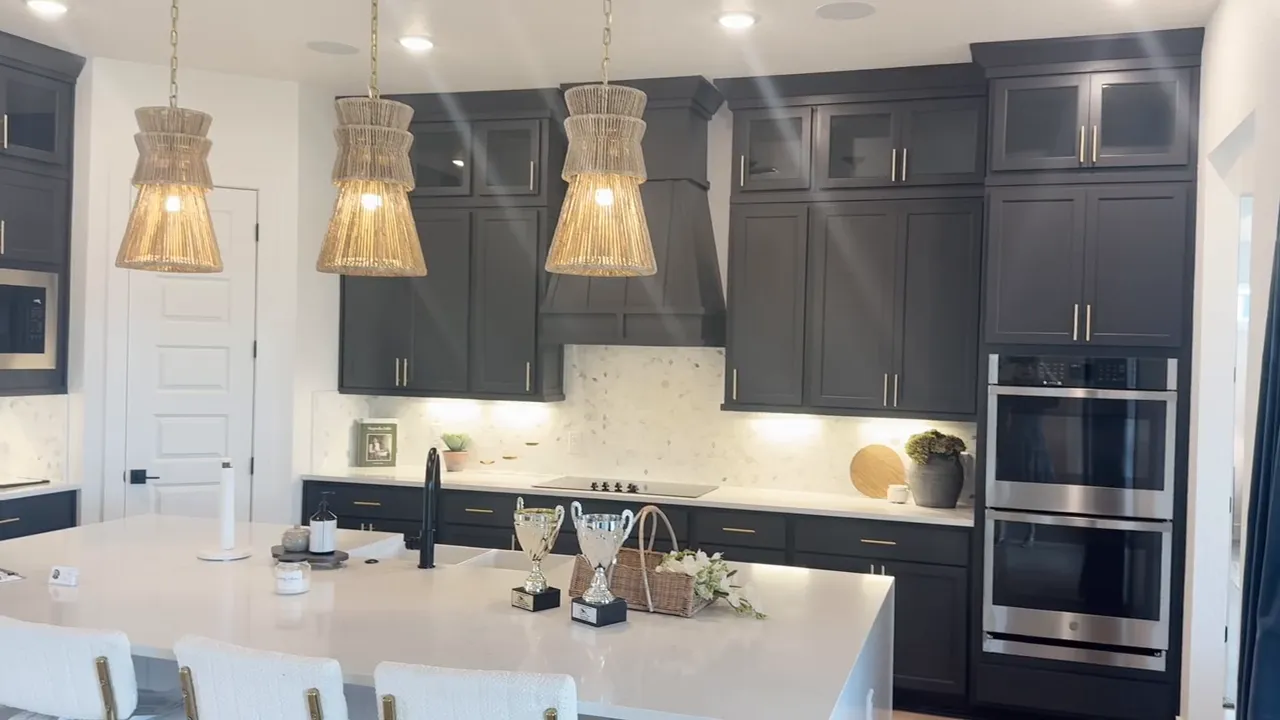 Heavy front door with stylish light fixtures in model home