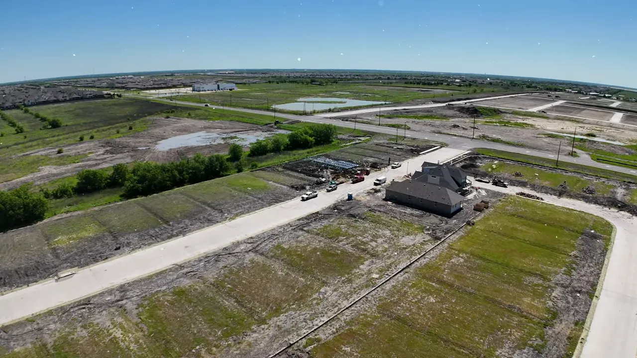 Aerial view of graded neighborhood lots with text reading 40 and 50 foot lots