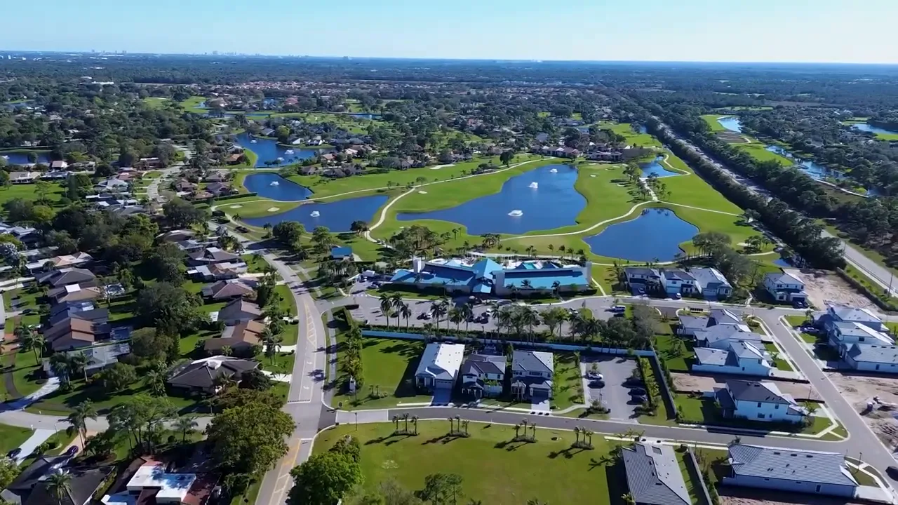 Aerial view over Palm Beach Gardens community labeled $250,000 off select move-in ready homes