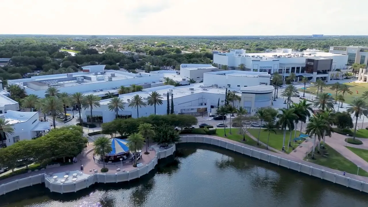 Aerial view of a luxury community with the text “Real Incentives” overlaid on screen