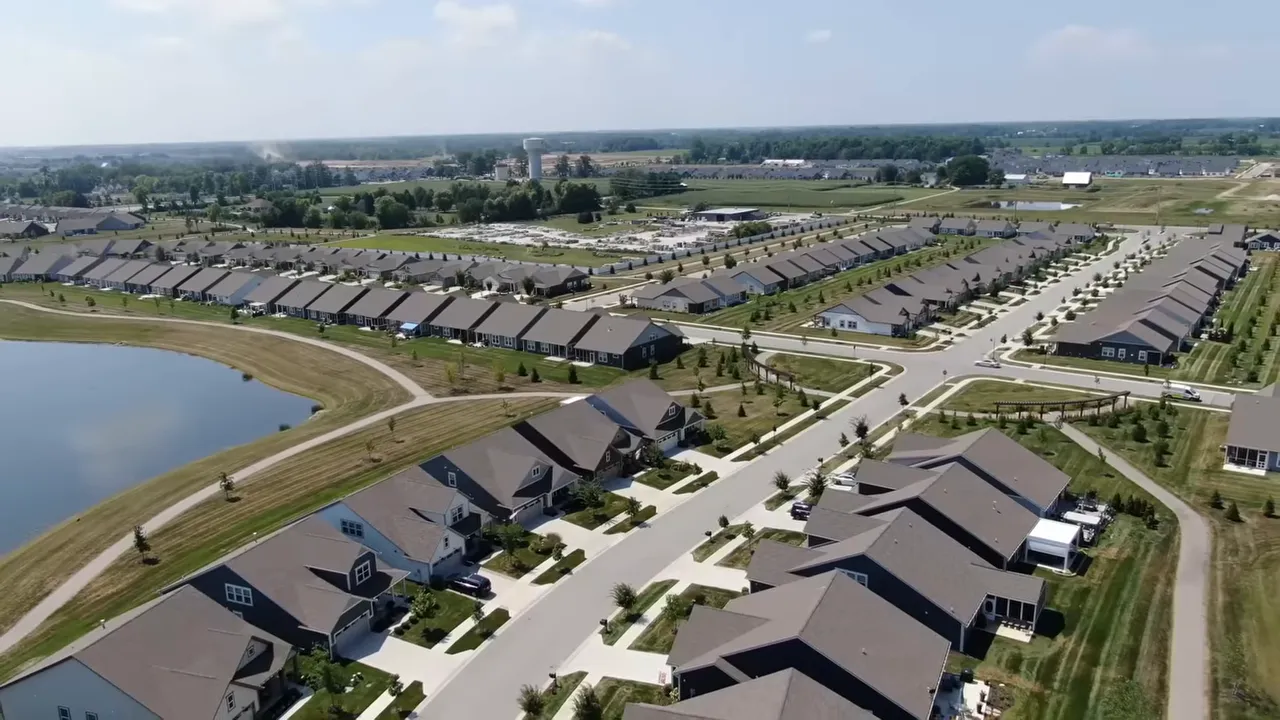 Presentation slide titled 'Why It Could Matter More Than a Crash' with six boxes; box 1 reads 'The market isn't crashing, it's stalling.'