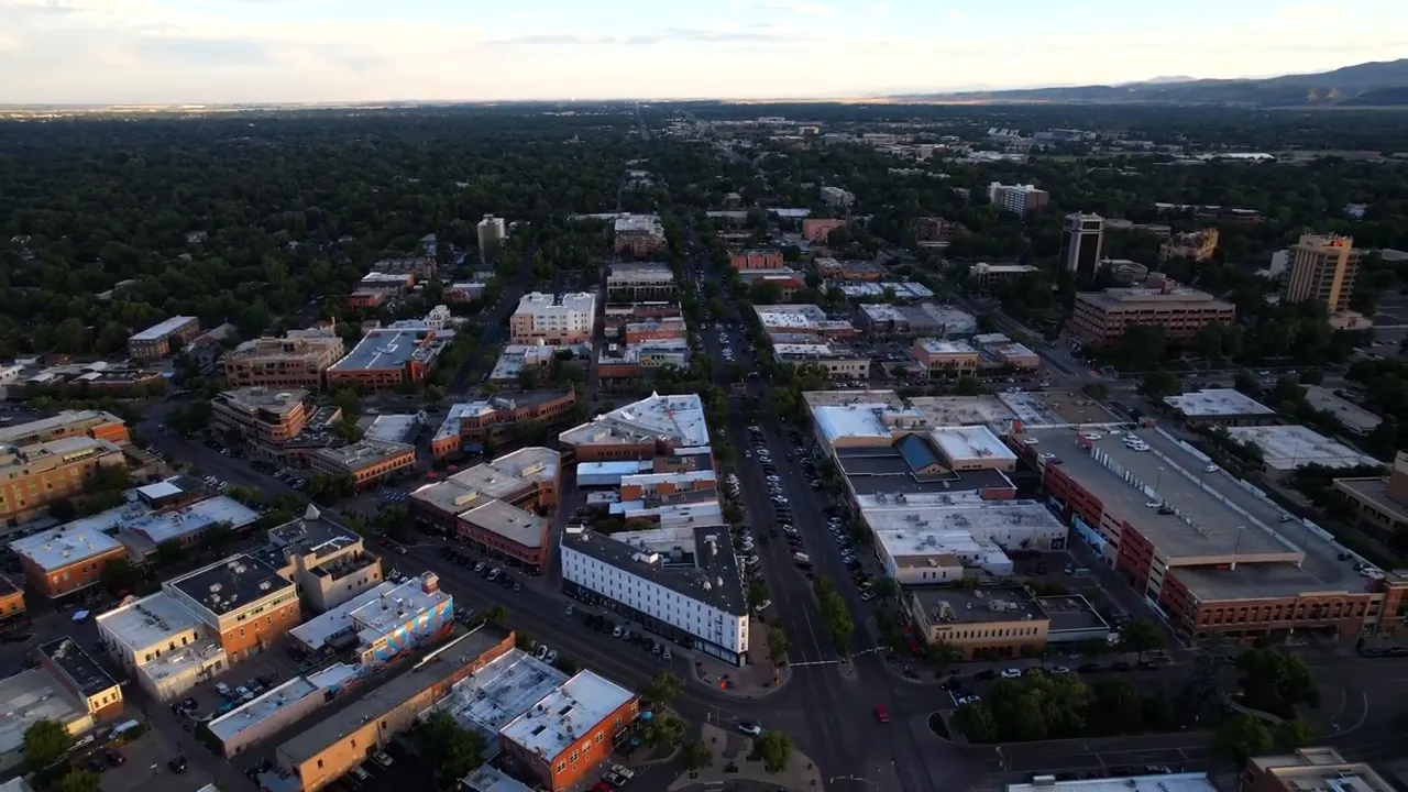Aerial view of Louisville Colorado showing a $1,200,000 home price graphic overlay