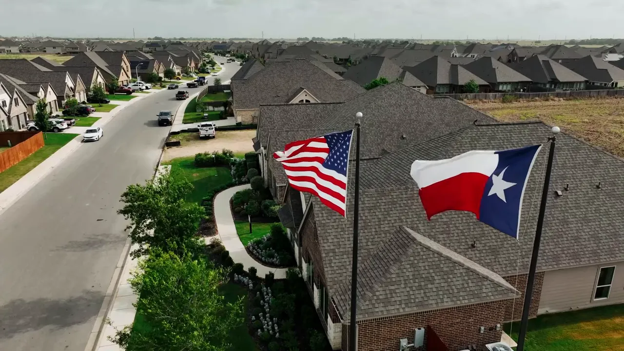 Presenter facing the camera in studio with a digital whiteboard and wooden slat wall behind, used as a closing summary image.