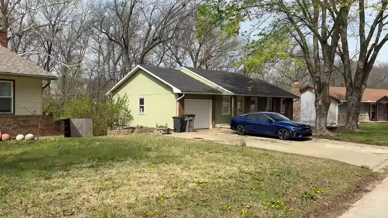 Fixer-upper style home exterior in Valley View neighborhood, Warrensburg MO with driveway and yard