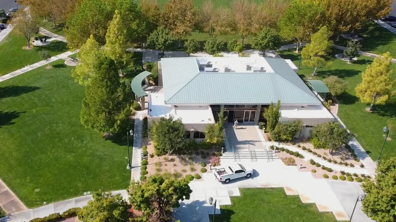 Two speakers in a studio with blue background talking about housing choices and trade-offs