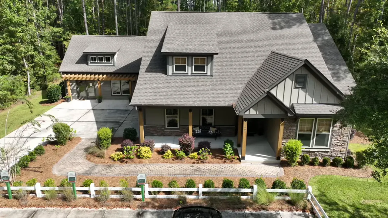 Guest bathroom vanity with marble-look countertop, soap dispenser, mirror and presenter in frame
