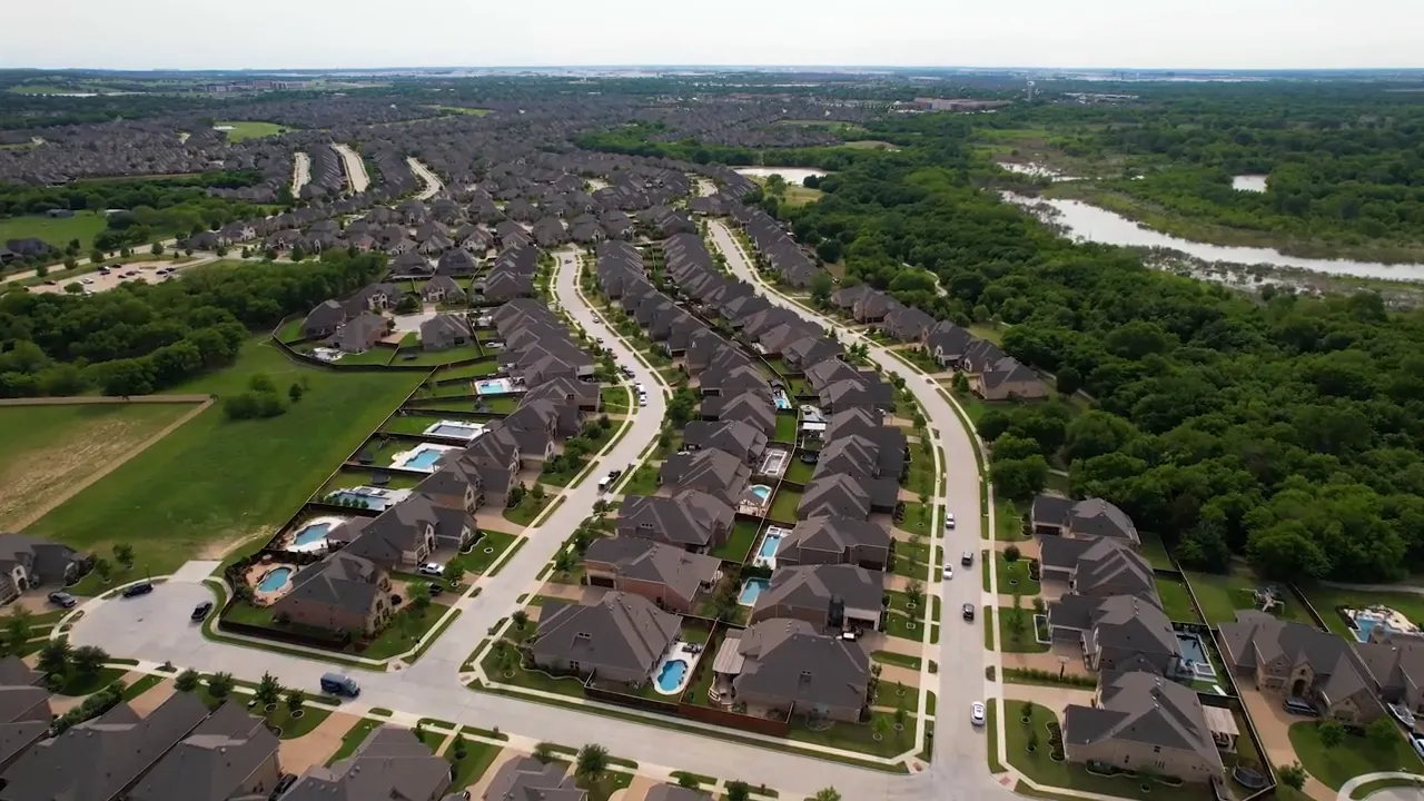 Studio presenter gesturing while on-screen phone number and email are displayed
