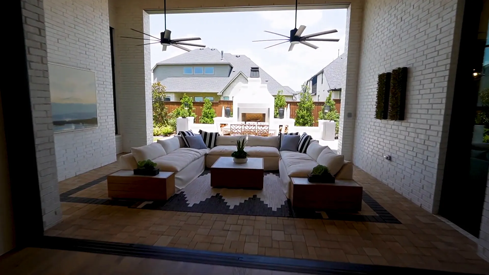 Front courtyard between the garages with fireplace and seating