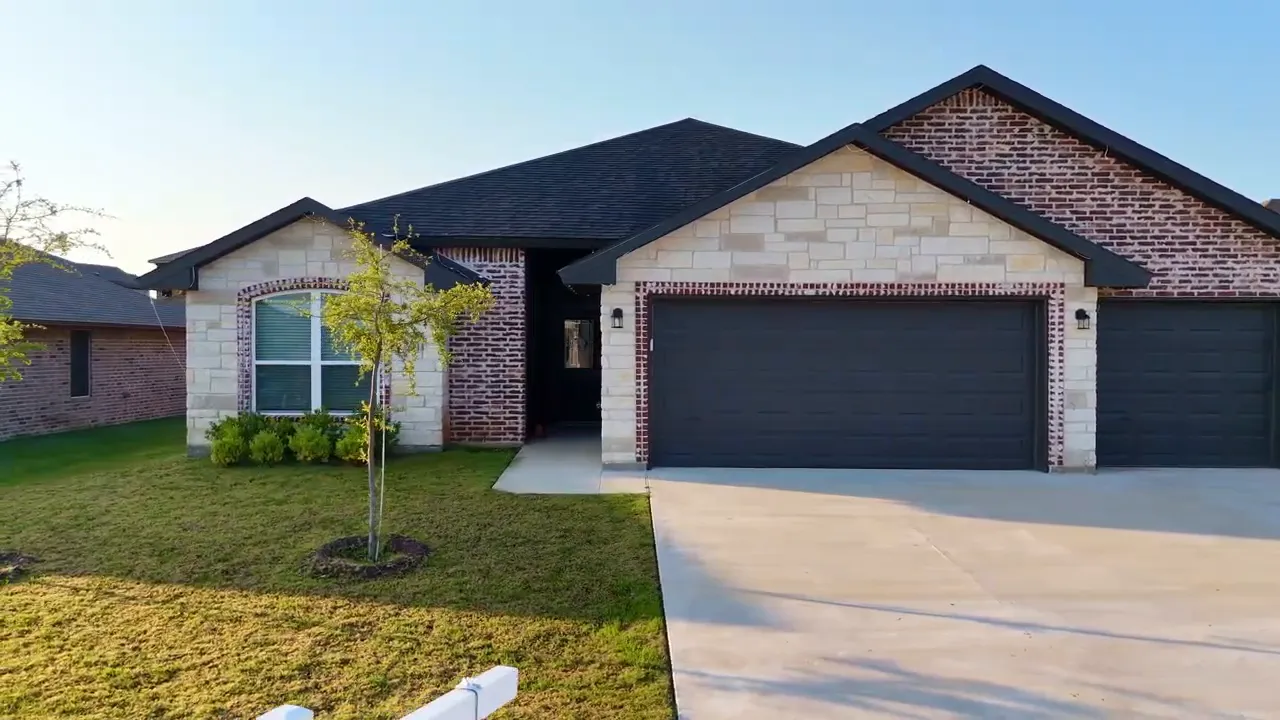 Open living area and kitchen at Iridium Drive with pendant lights