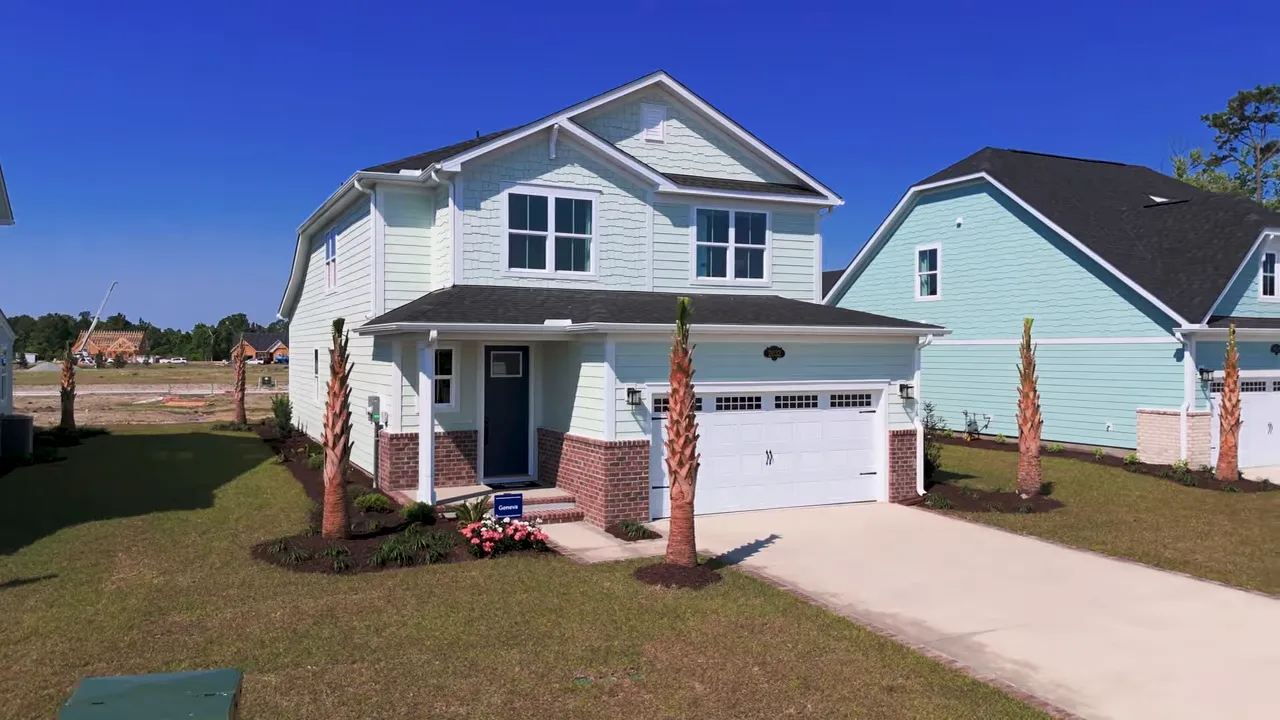 Front exterior view of a new construction home with two-car garage and landscaping in a Myrtle Beach SC neighborhood