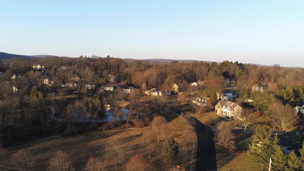 Aerial neighborhood view of Mendham Township with 'Living in Jersey' title overlay