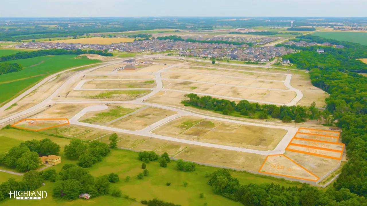 Aerial view of homesites with text reading 75 treelined homesites