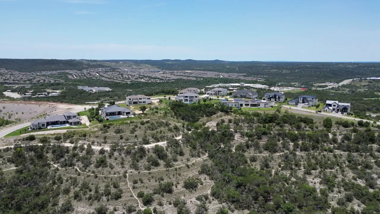 wide hill country view over neighborhoods and ridgelines