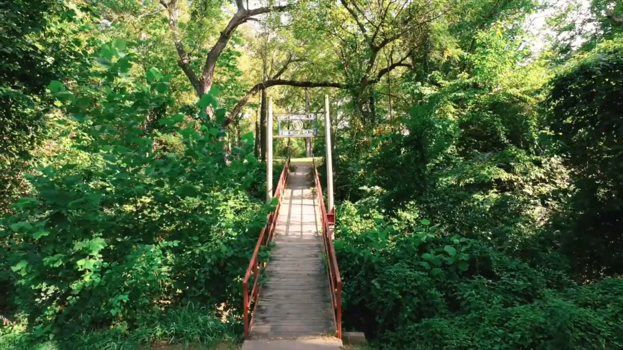 Mar Park green area with trees and walkway in Warrensburg Missouri