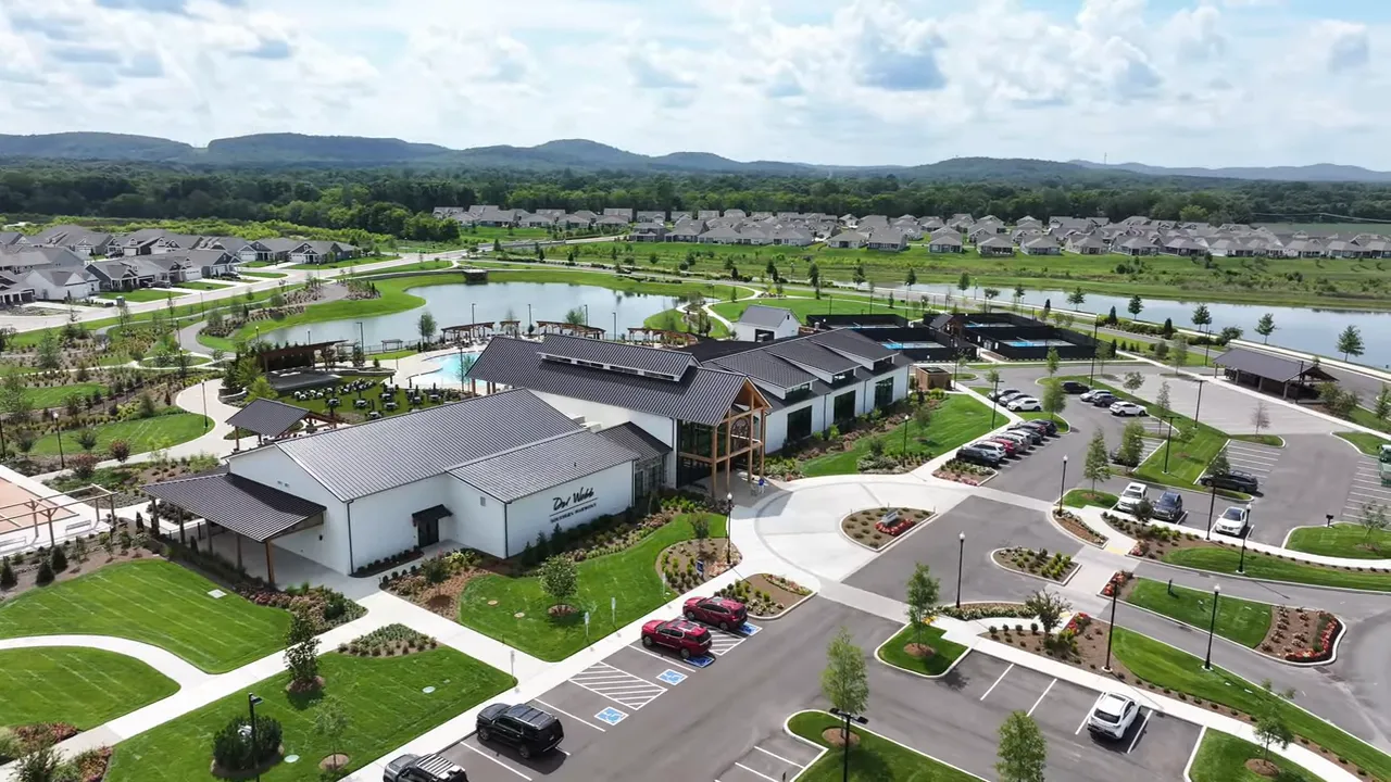 Aerial view of amenity center pool and surrounding community