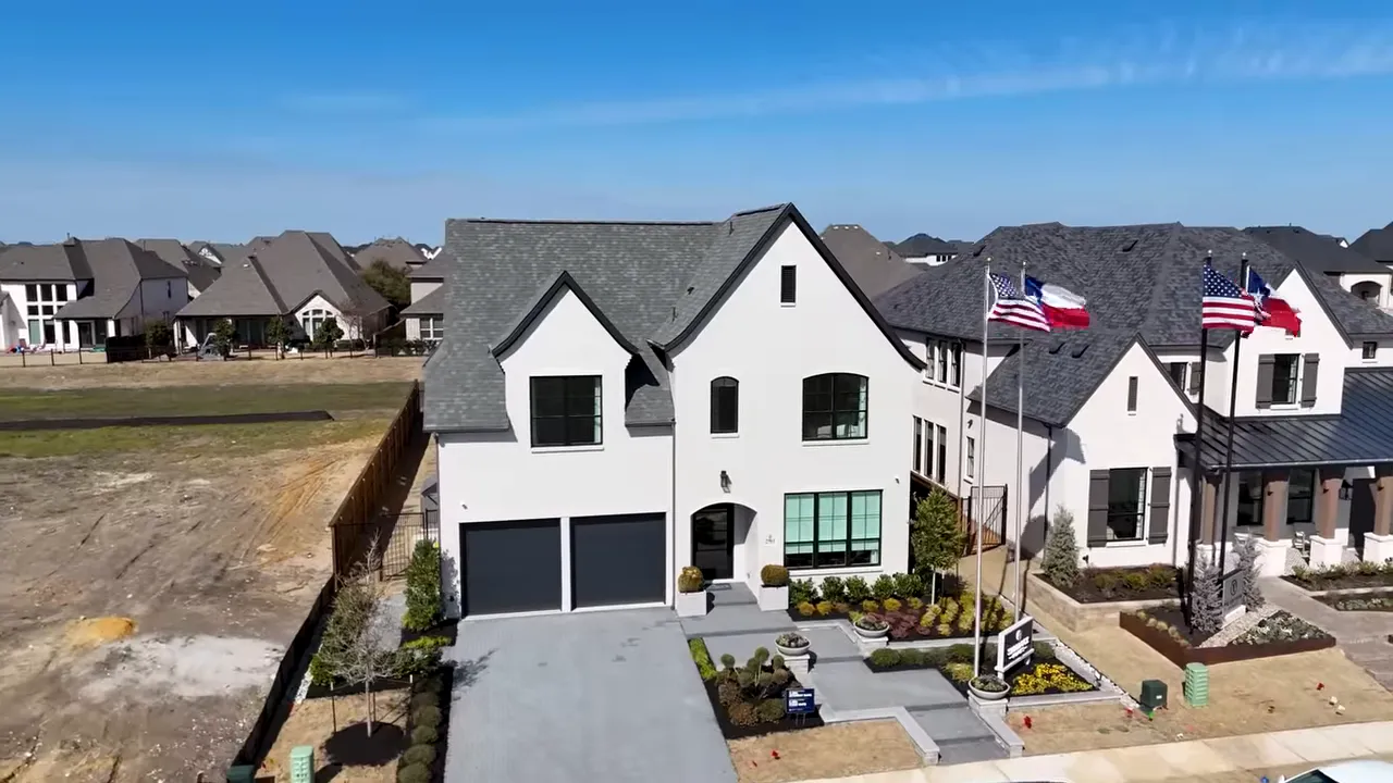 Exterior of the model home with manicured landscaping and entryway