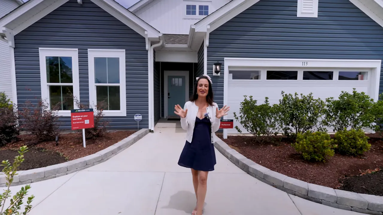 Front entry walkway and garage facade of a new construction home in Conway South Carolina