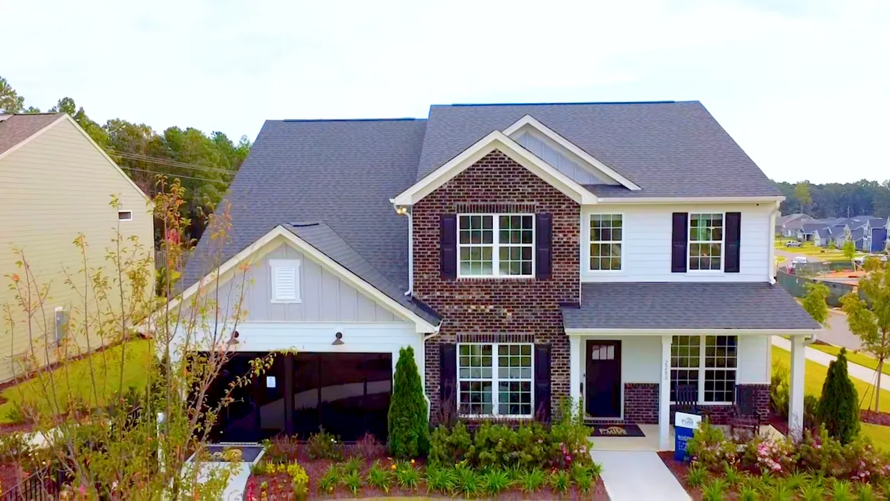 Riverton entryway with tray ceiling and dining room