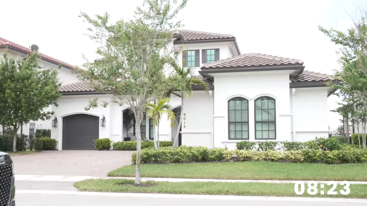 Tree-lined residential street with single-family homes