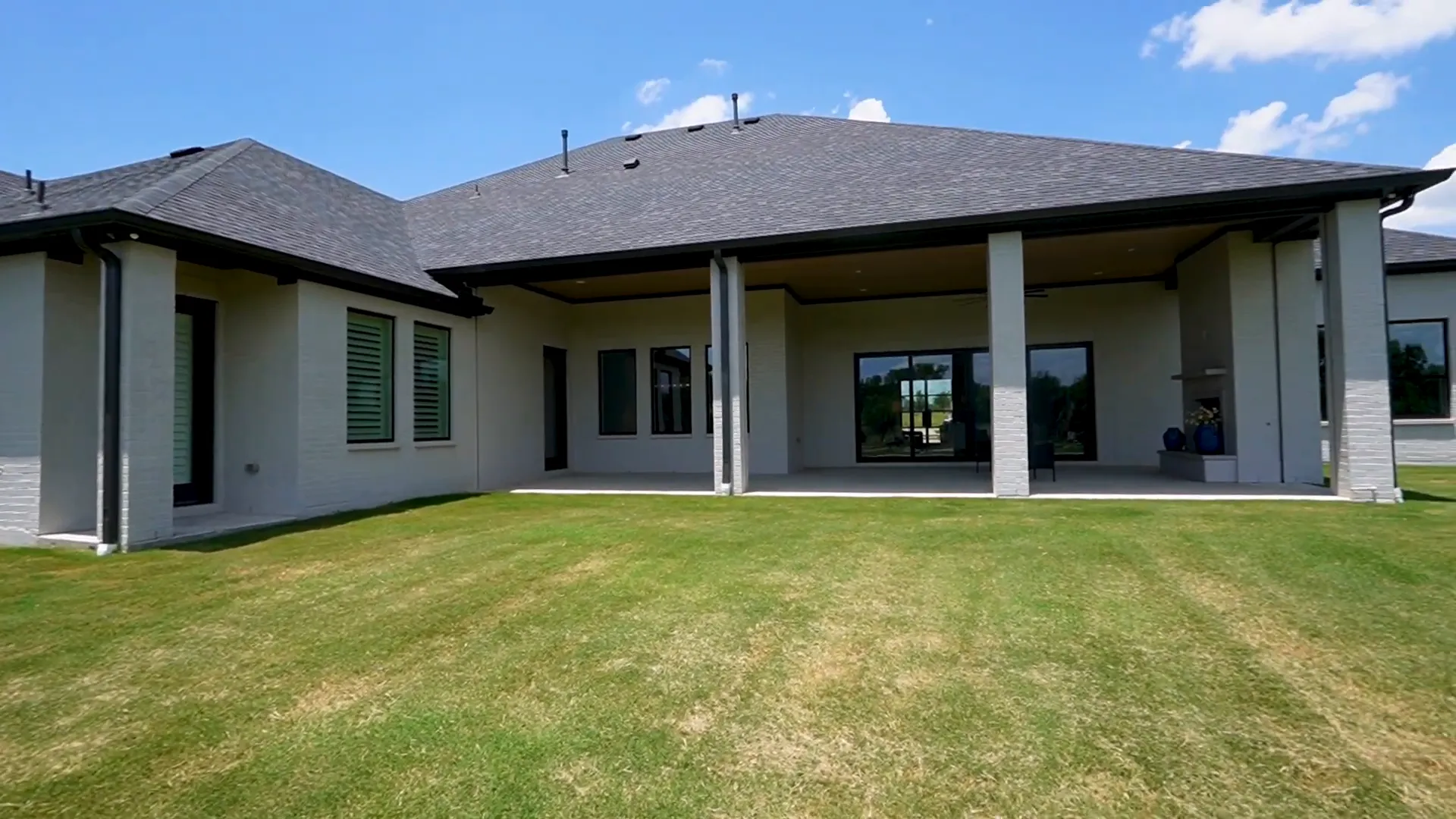 Covered patio with motorized sunscreens and TV mount