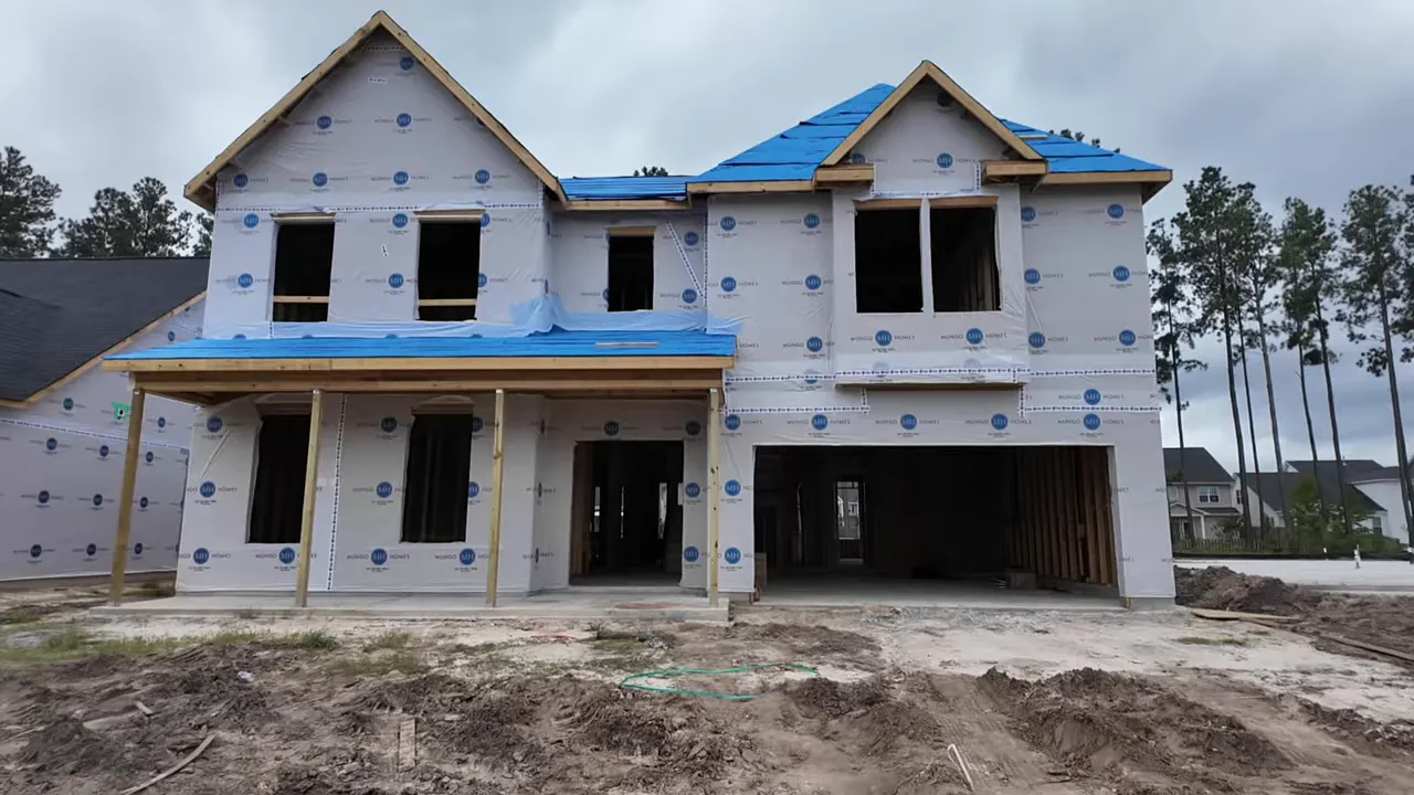Framed exterior of the Yates home under construction in Cane Bay, South Carolina showing 5 bedrooms, 4.5 bathrooms, and 4,157 square feet
