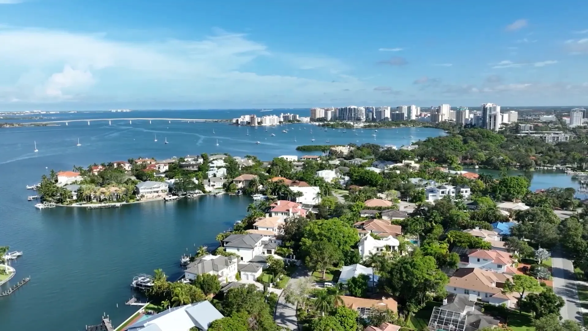 Homes along Sarasota waterfront discussing flood risk