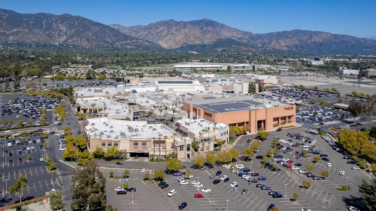 Aerial view of Westfield Santa Anita shopping center with mountains behind it