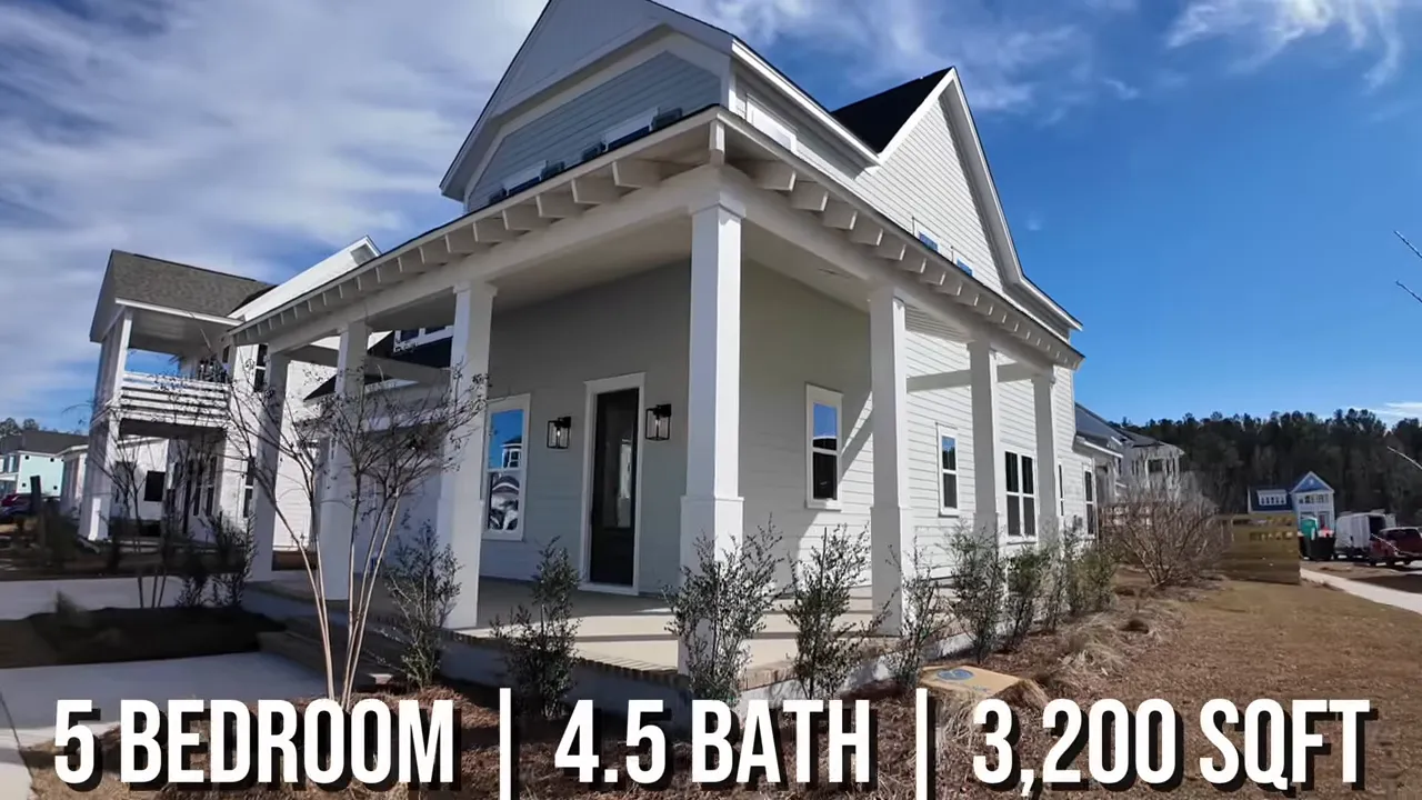 Bright flex room with a desk, shelving, and a window visible off the home entry